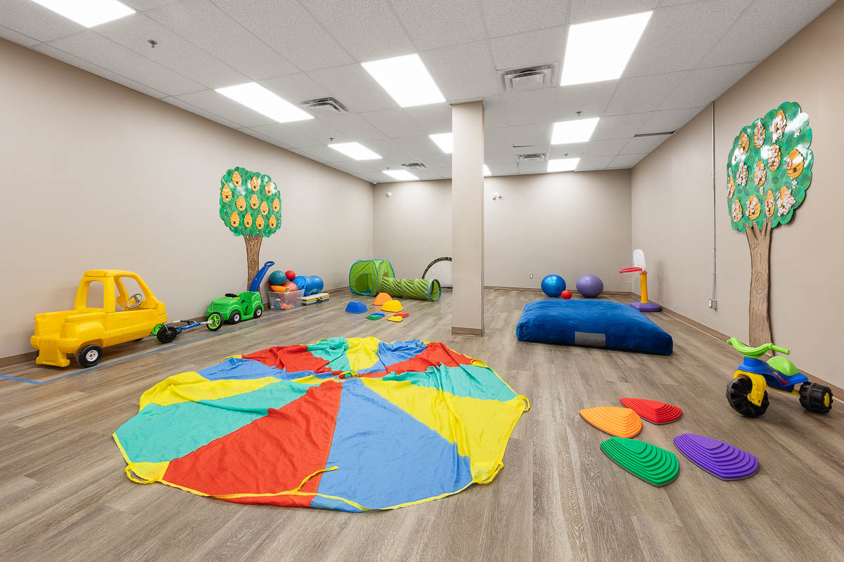 A play area with toys on the floor at AlphaBee's Etobicoke centre