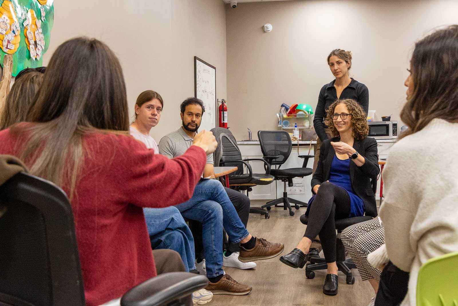 A clinician leading a small group discussion