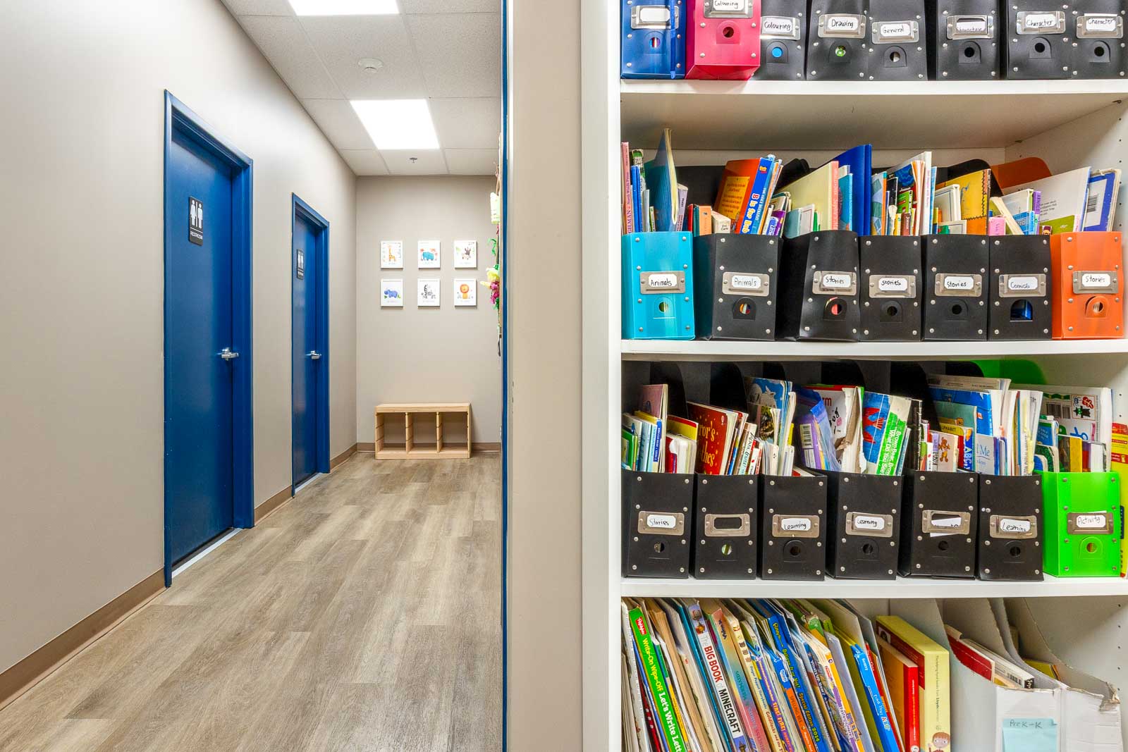Shelves of language books and materials at AlphaBee